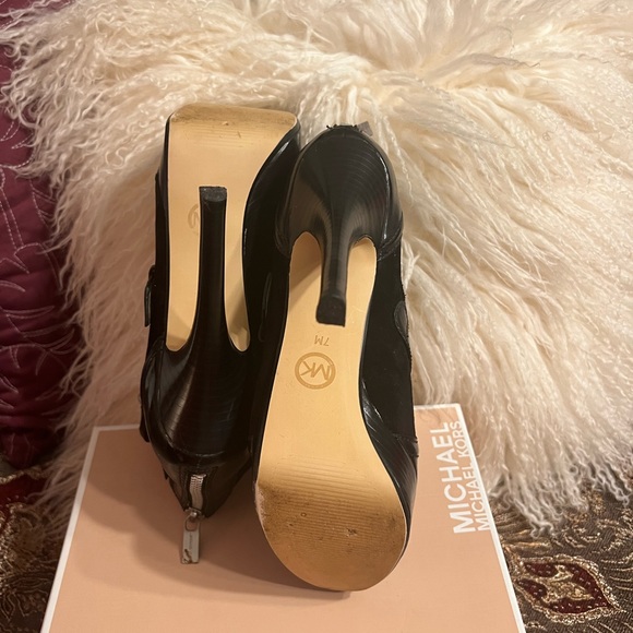 Michael Kors patent leather platform heels. Buckles and ankle height. 
Size 7M - Picture 13 of 16